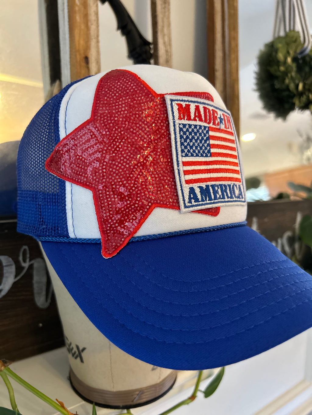 Blue and white trucker hat with Made In America with sequin star iron on patch